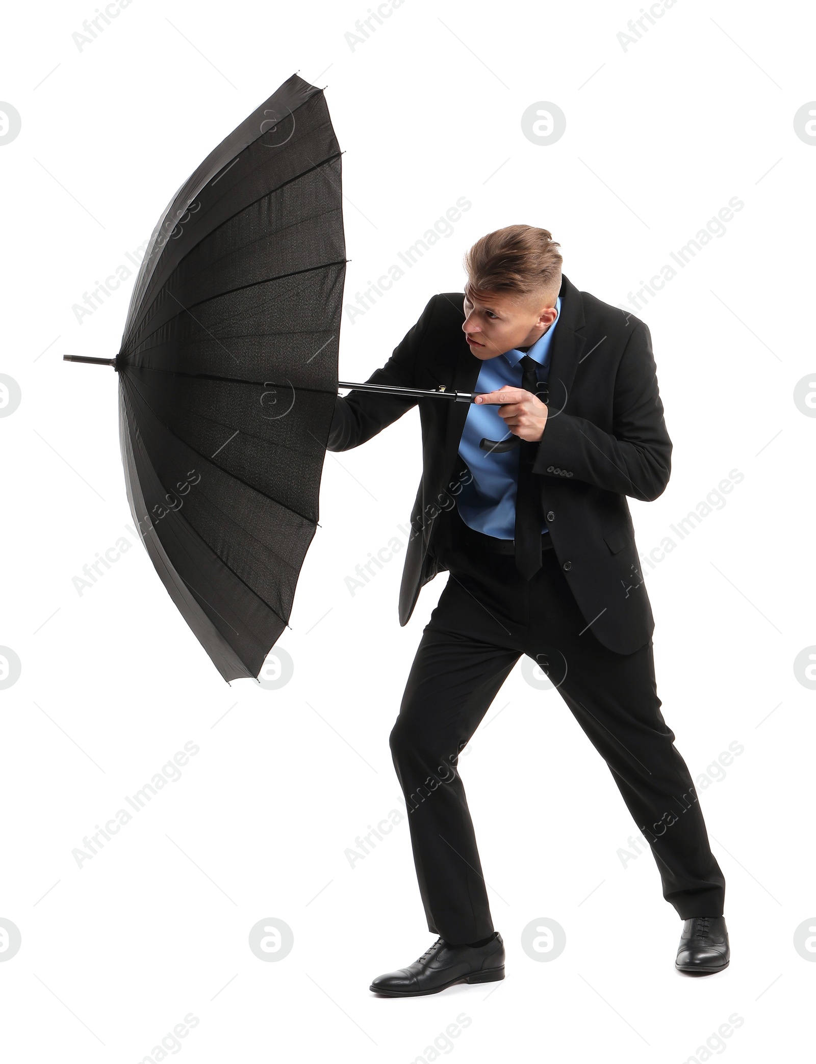 Photo of Man in suit with black umbrella on white background