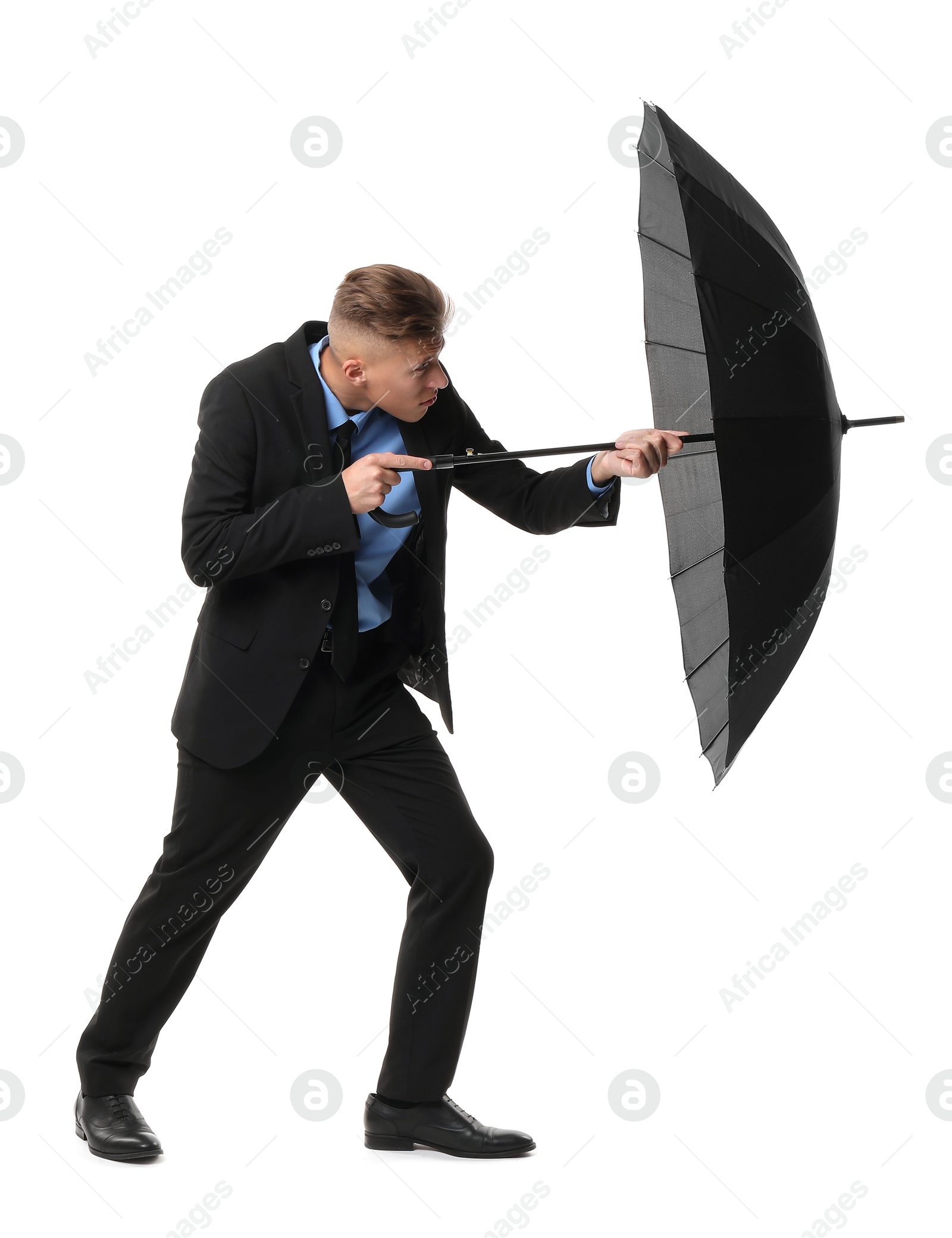 Photo of Man in suit with black umbrella on white background