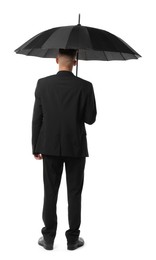 Photo of Man in suit with black umbrella on white background, back view