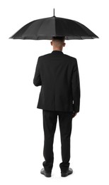 Photo of Man in suit with black umbrella on white background, back view