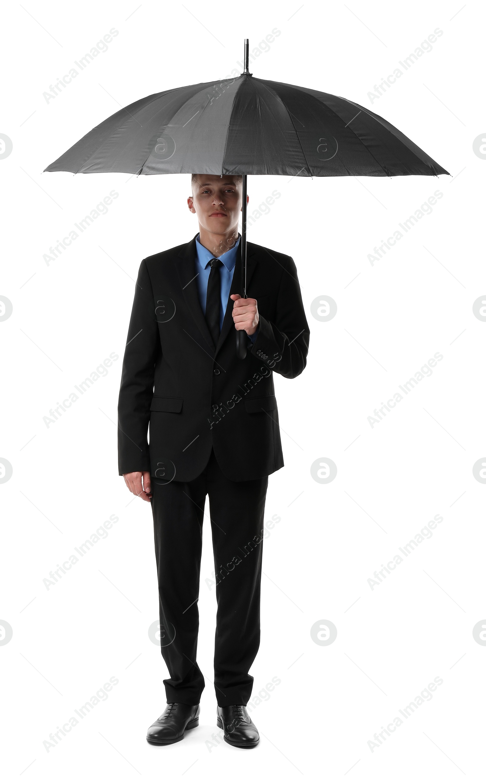 Photo of Man in suit with black umbrella on white background