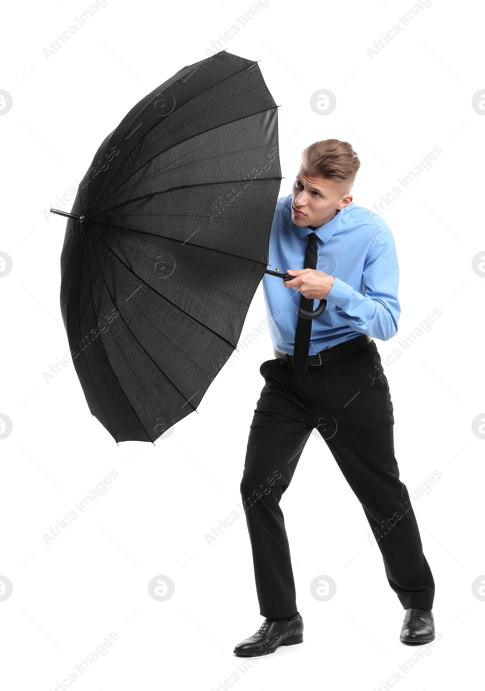 Photo of Man with black umbrella on white background