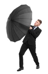 Photo of Man in suit with black umbrella on white background