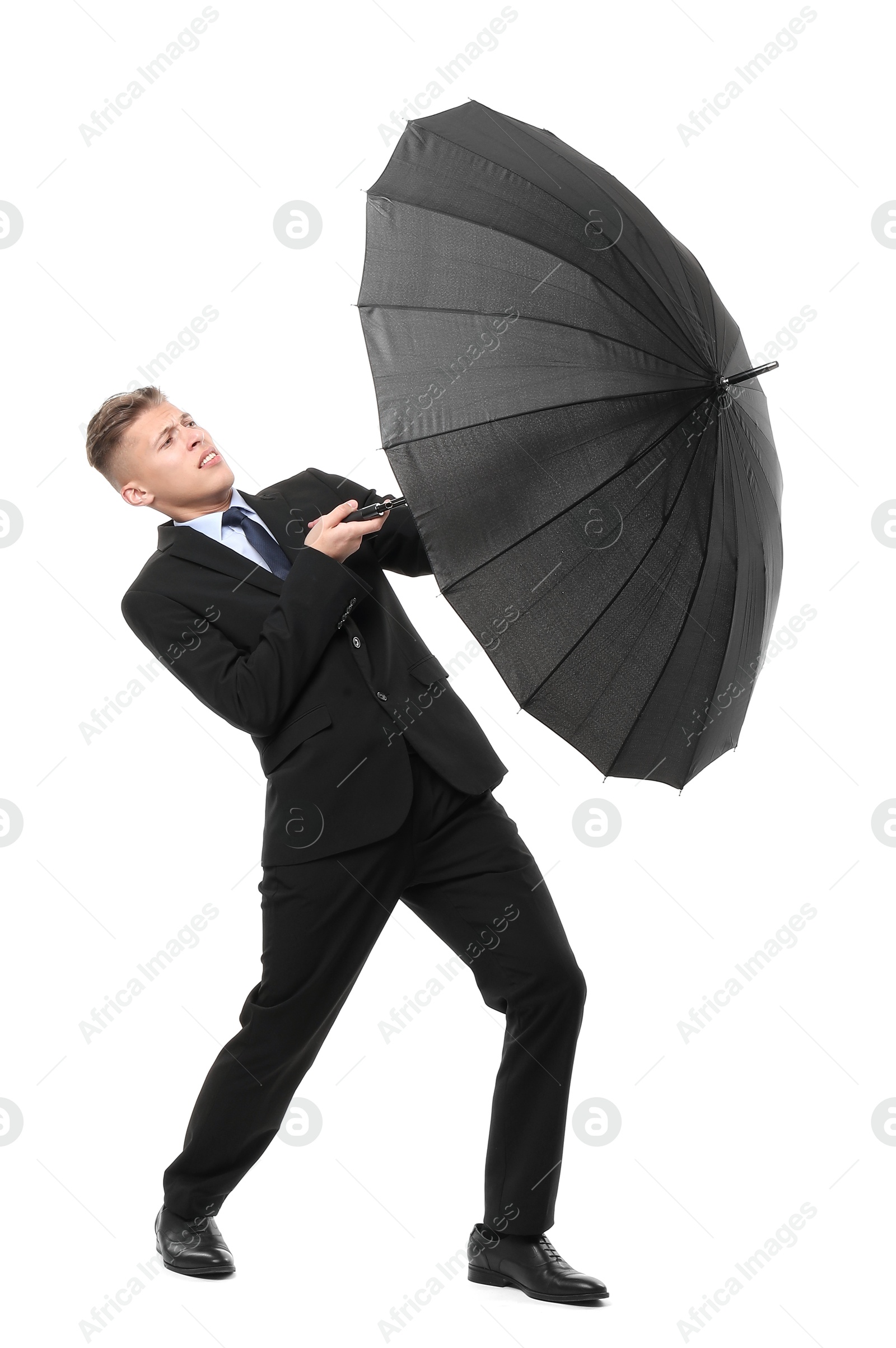 Photo of Man in suit with black umbrella on white background