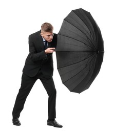 Photo of Man in suit with black umbrella on white background