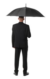 Man in suit with black umbrella on white background, back view