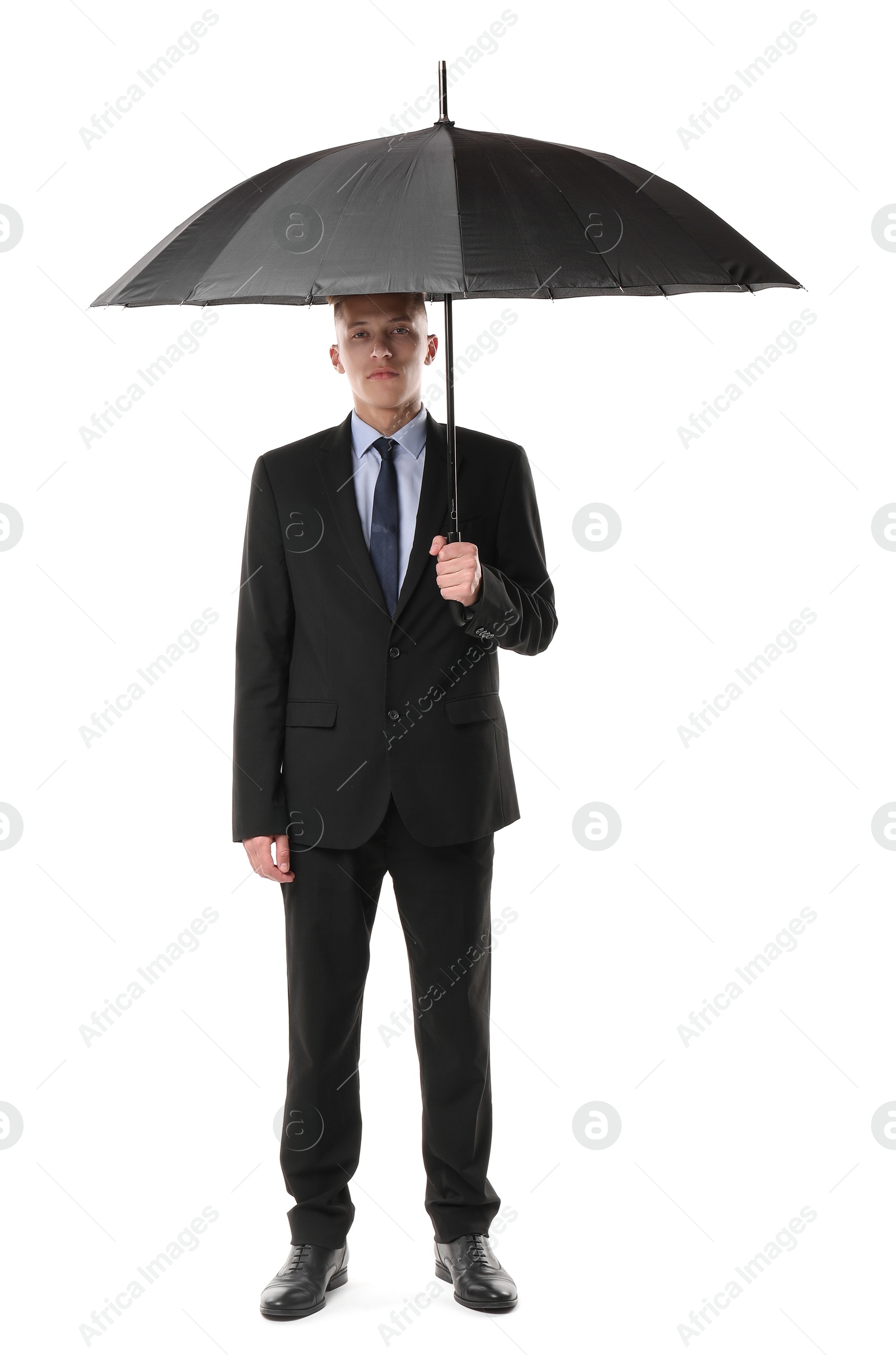 Photo of Man in suit with black umbrella on white background