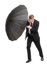 Photo of Man in suit with black umbrella on white background