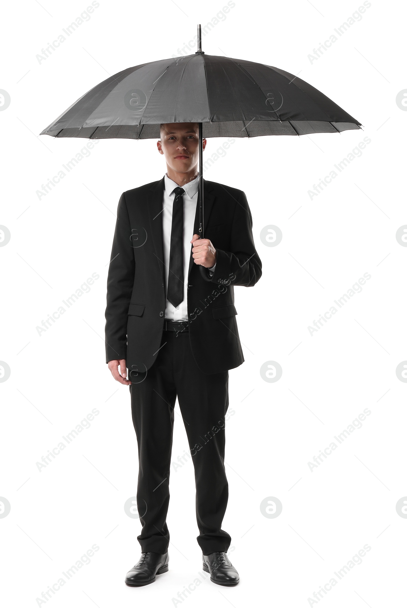 Photo of Man in suit with black umbrella on white background