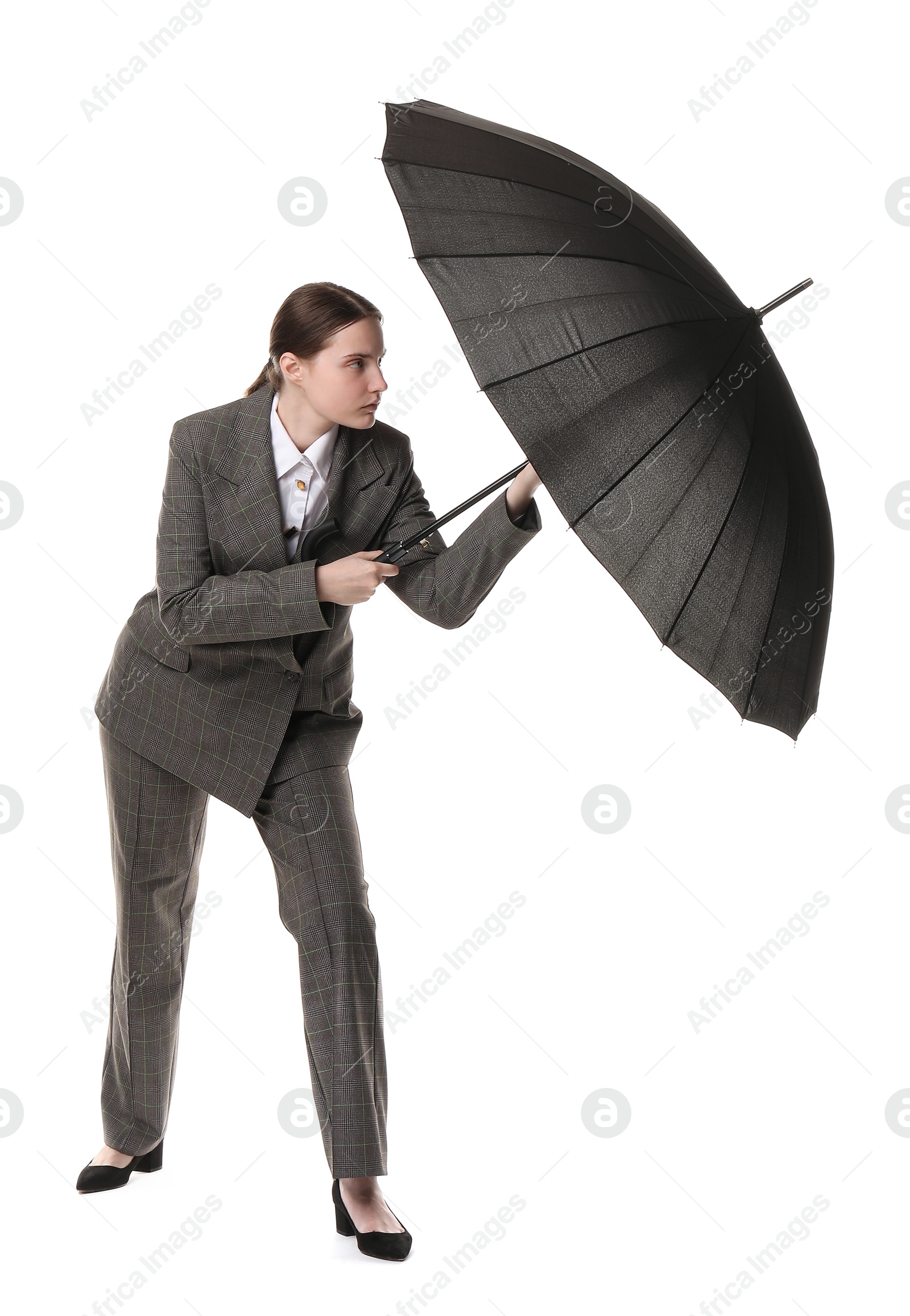 Photo of Young woman with black umbrella on white background