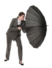 Photo of Young woman with black umbrella on white background