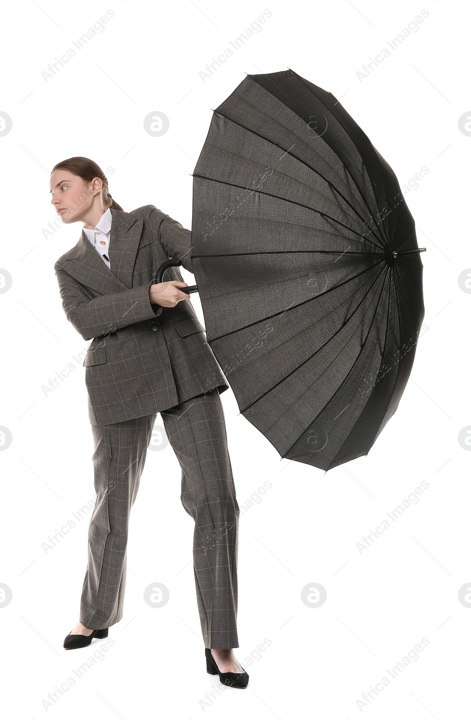 Photo of Young woman with black umbrella on white background