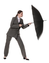 Photo of Young woman with black umbrella on white background