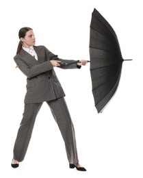 Photo of Young woman with black umbrella on white background