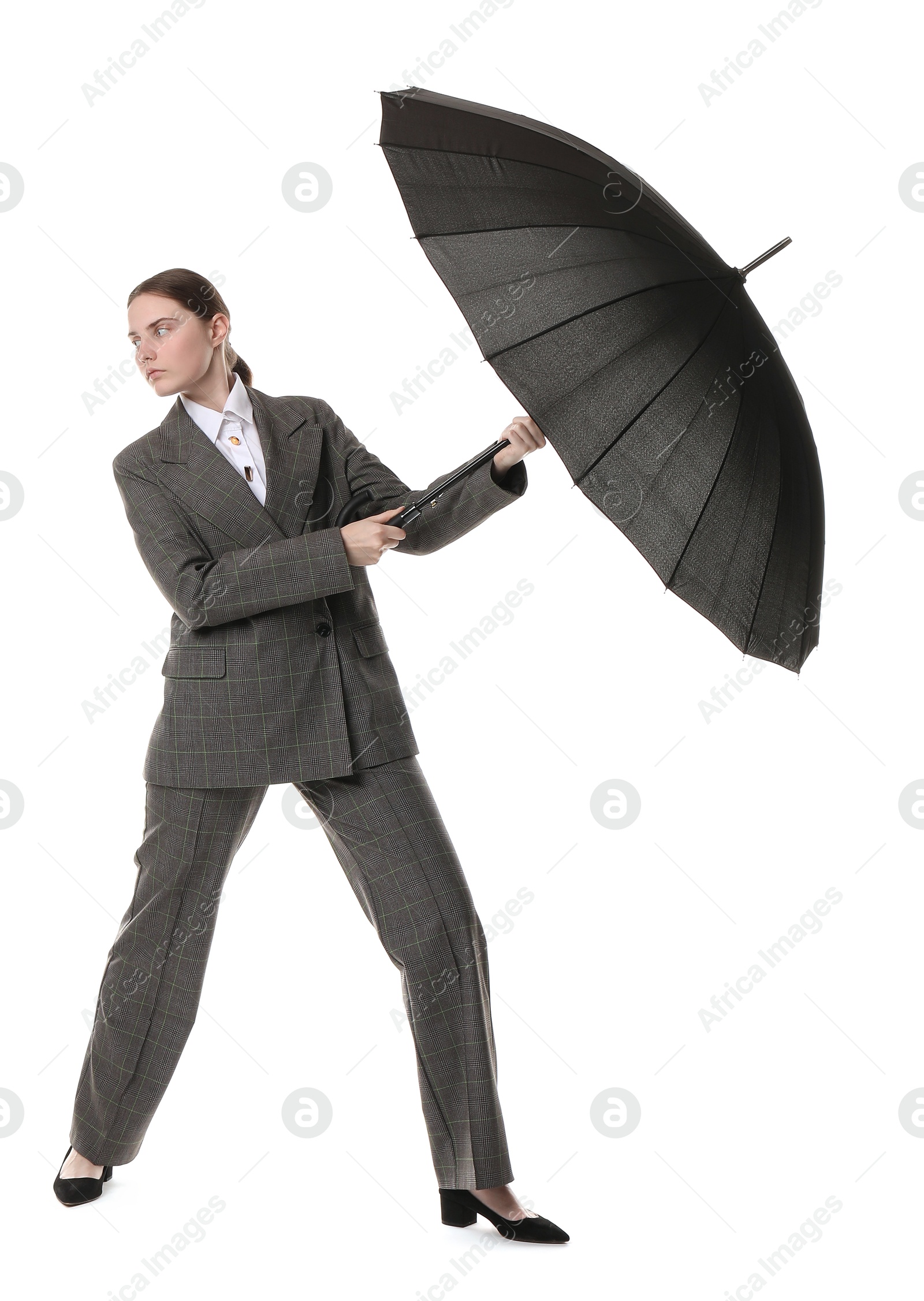 Photo of Young woman with black umbrella on white background