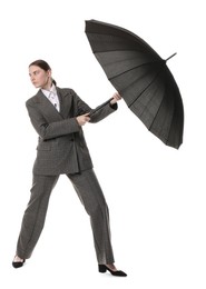 Photo of Young woman with black umbrella on white background