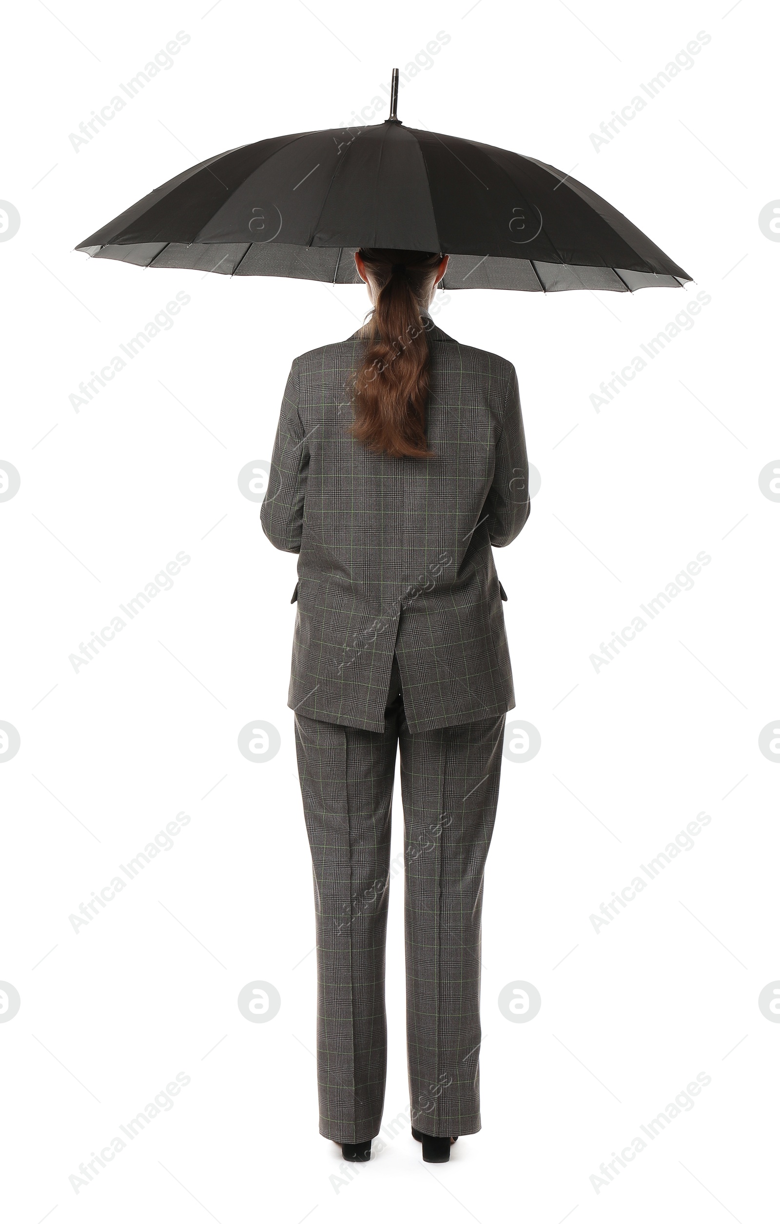 Photo of Young woman with black umbrella on white background, back view