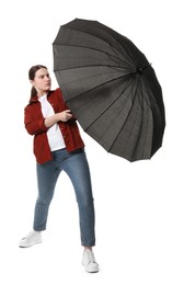 Photo of Young woman with black umbrella on white background