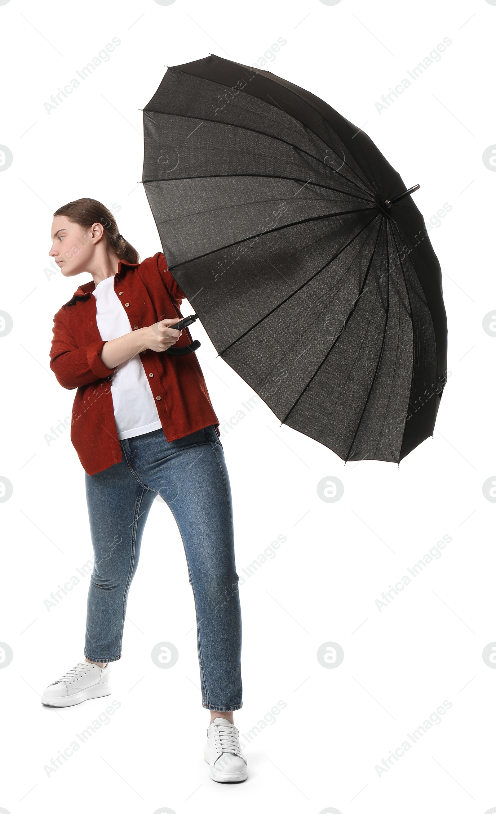 Photo of Young woman with black umbrella on white background