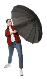 Photo of Young woman with black umbrella on white background