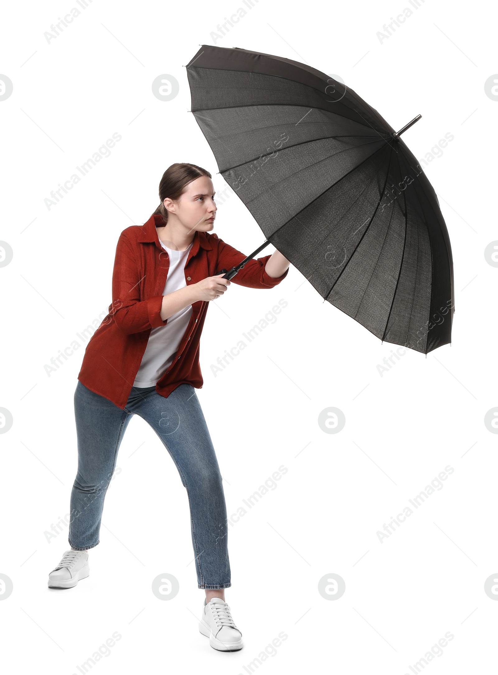 Photo of Young woman with black umbrella on white background