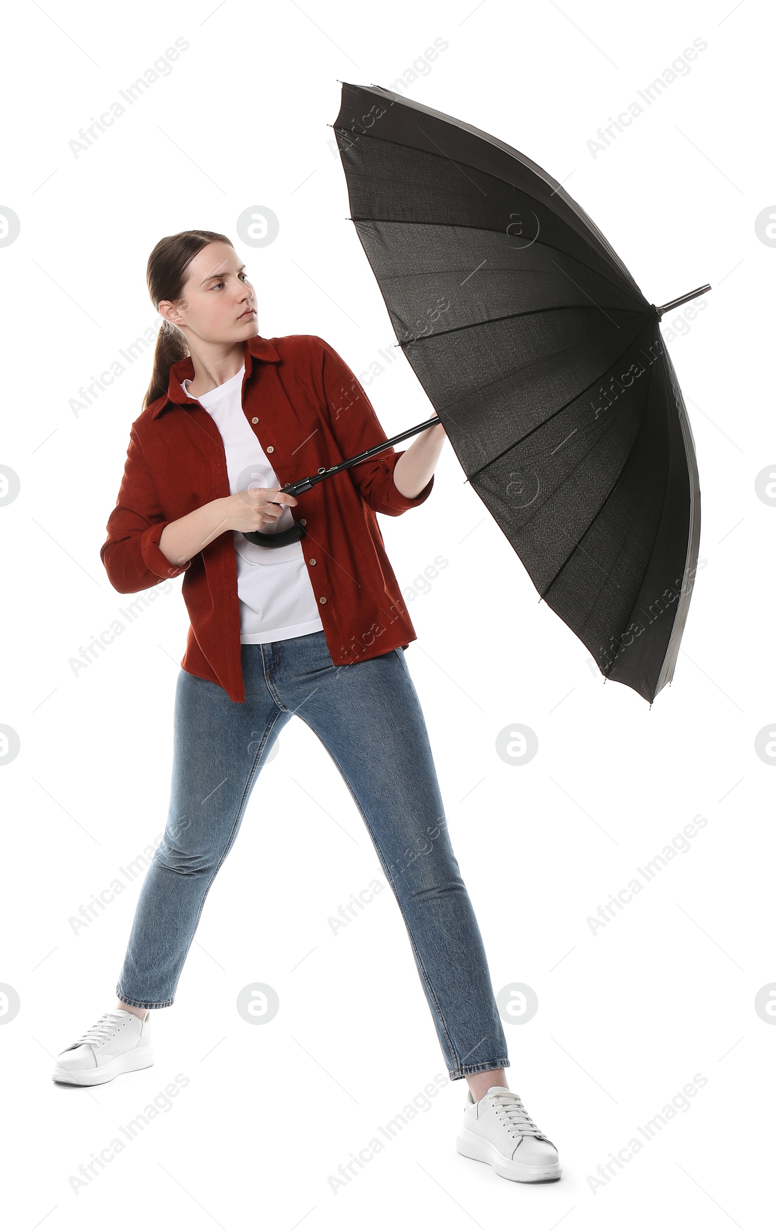 Photo of Young woman with black umbrella on white background