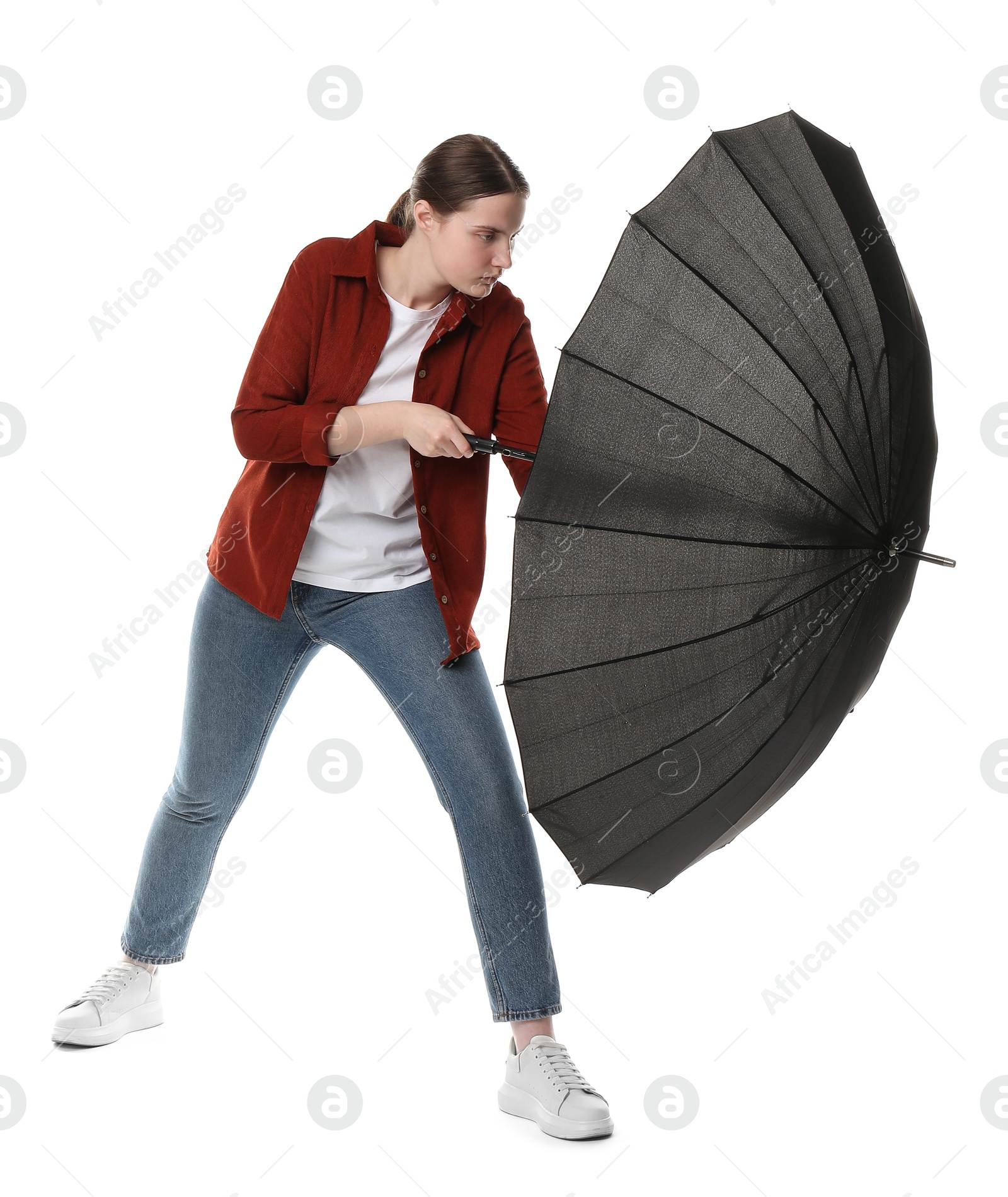 Photo of Young woman with black umbrella on white background