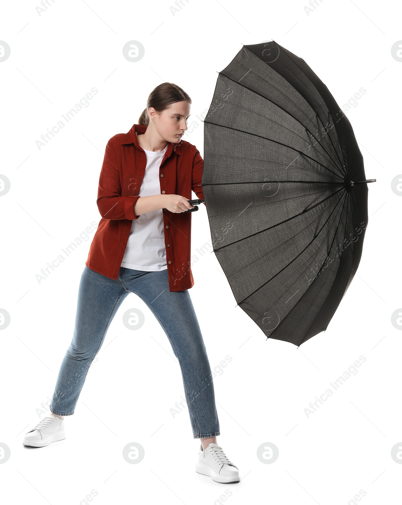 Photo of Young woman with black umbrella on white background