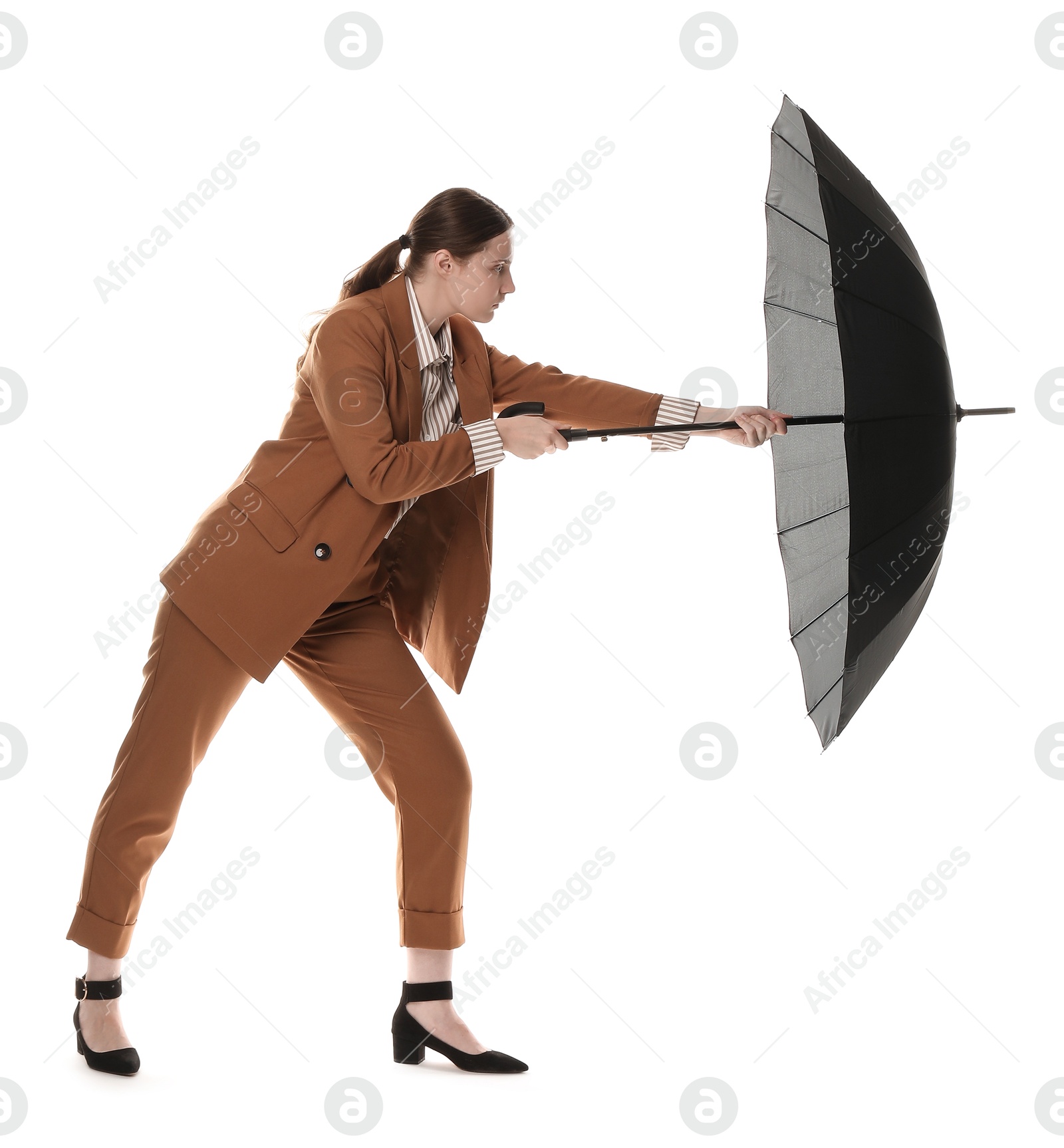 Photo of Young woman with black umbrella on white background