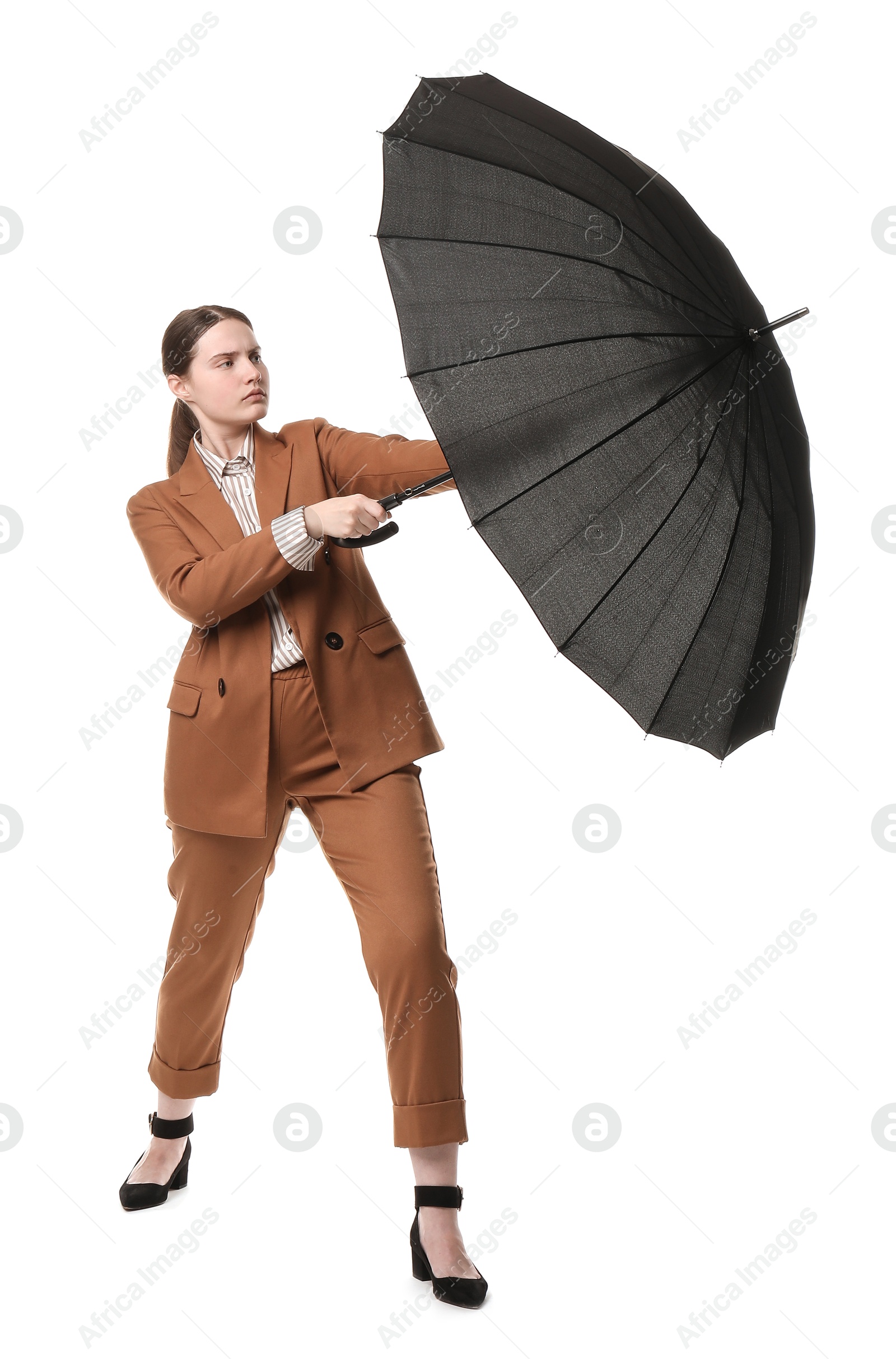 Photo of Young woman with black umbrella on white background