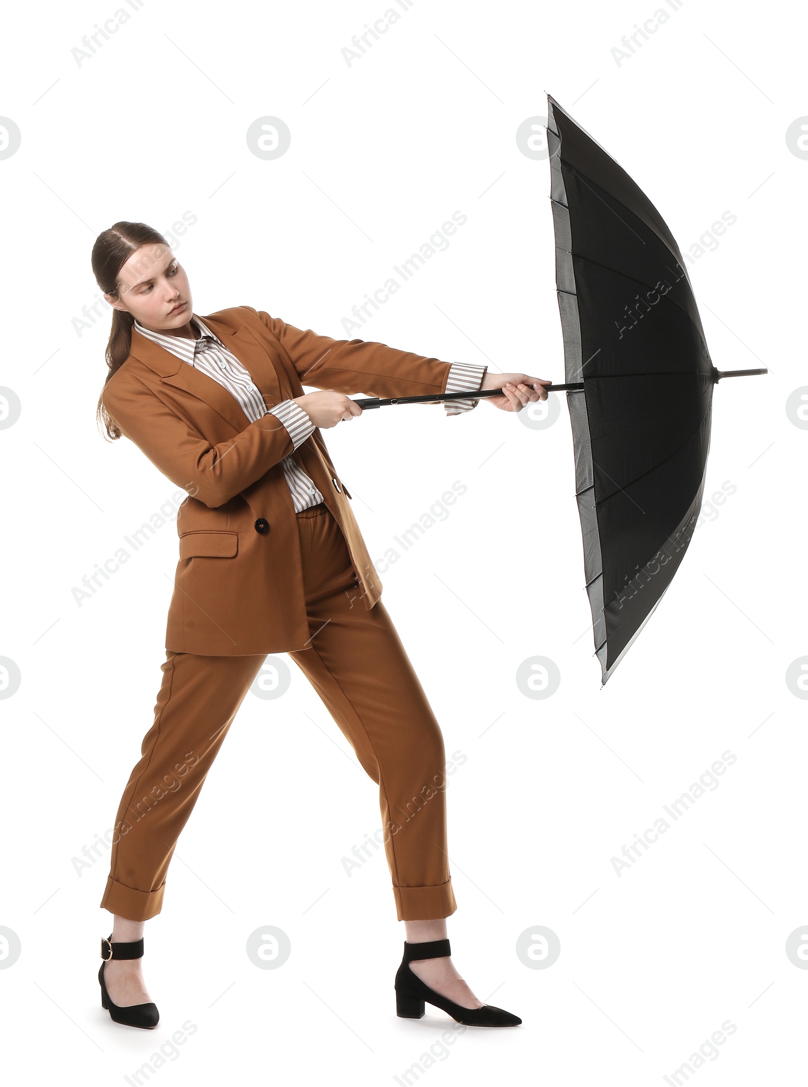 Photo of Young woman with black umbrella on white background