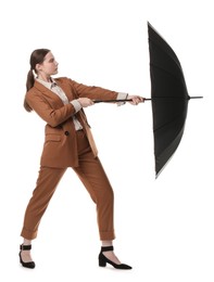 Photo of Young woman with black umbrella on white background