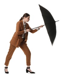 Photo of Young woman with black umbrella on white background