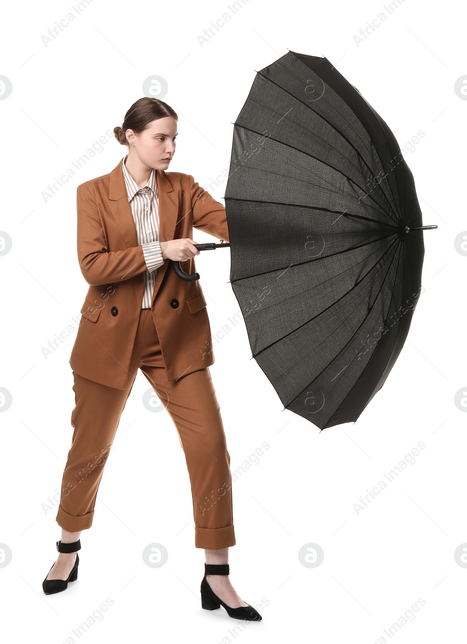 Photo of Young woman with black umbrella on white background