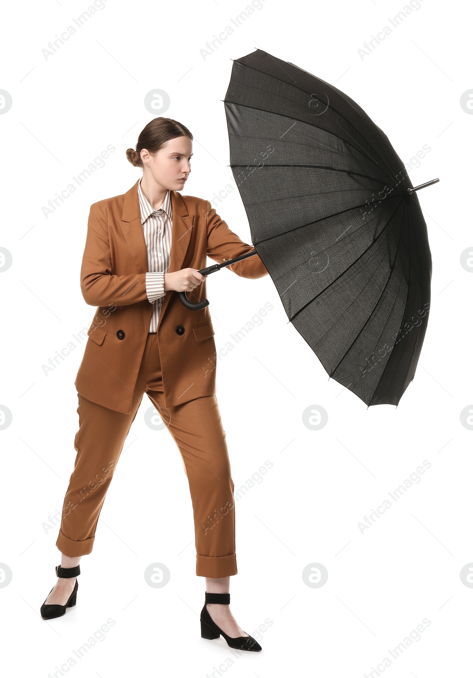 Photo of Young woman with black umbrella on white background