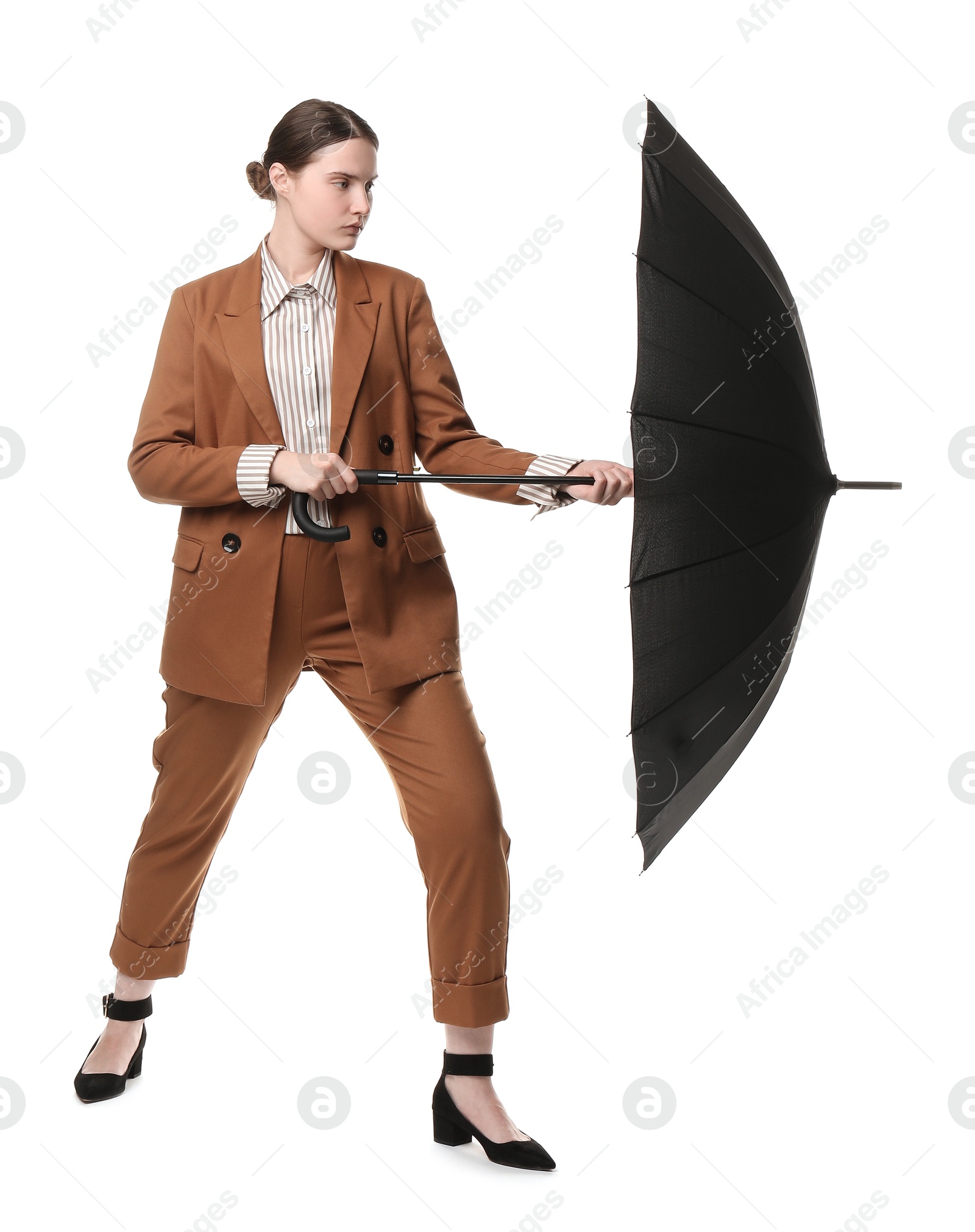 Photo of Young woman with black umbrella on white background