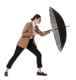 Photo of Young woman with black umbrella on white background