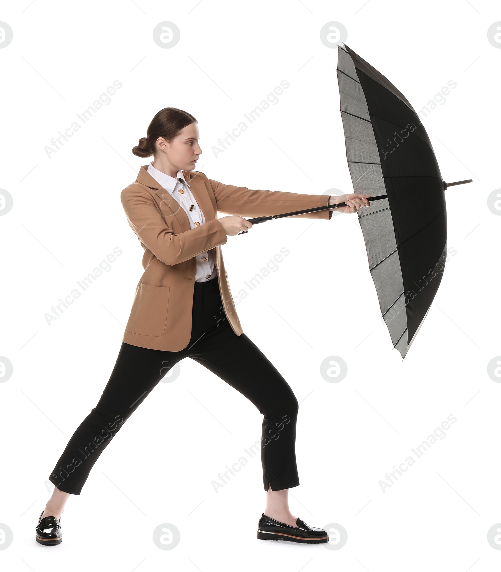 Photo of Young woman with black umbrella on white background