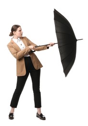 Photo of Young woman with black umbrella on white background