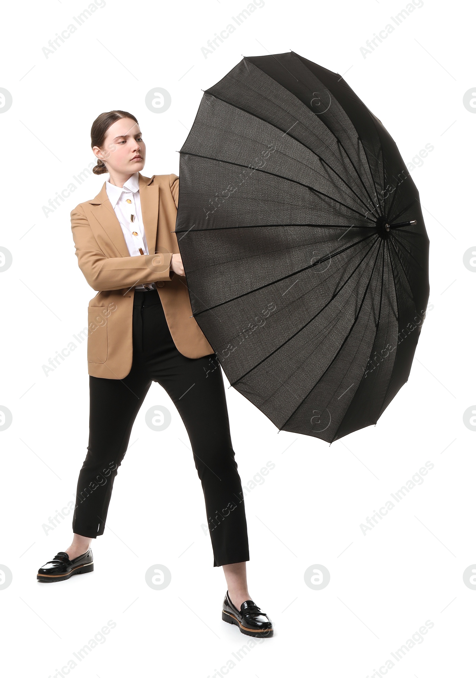 Photo of Young woman with black umbrella on white background