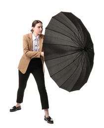 Photo of Young woman with black umbrella on white background