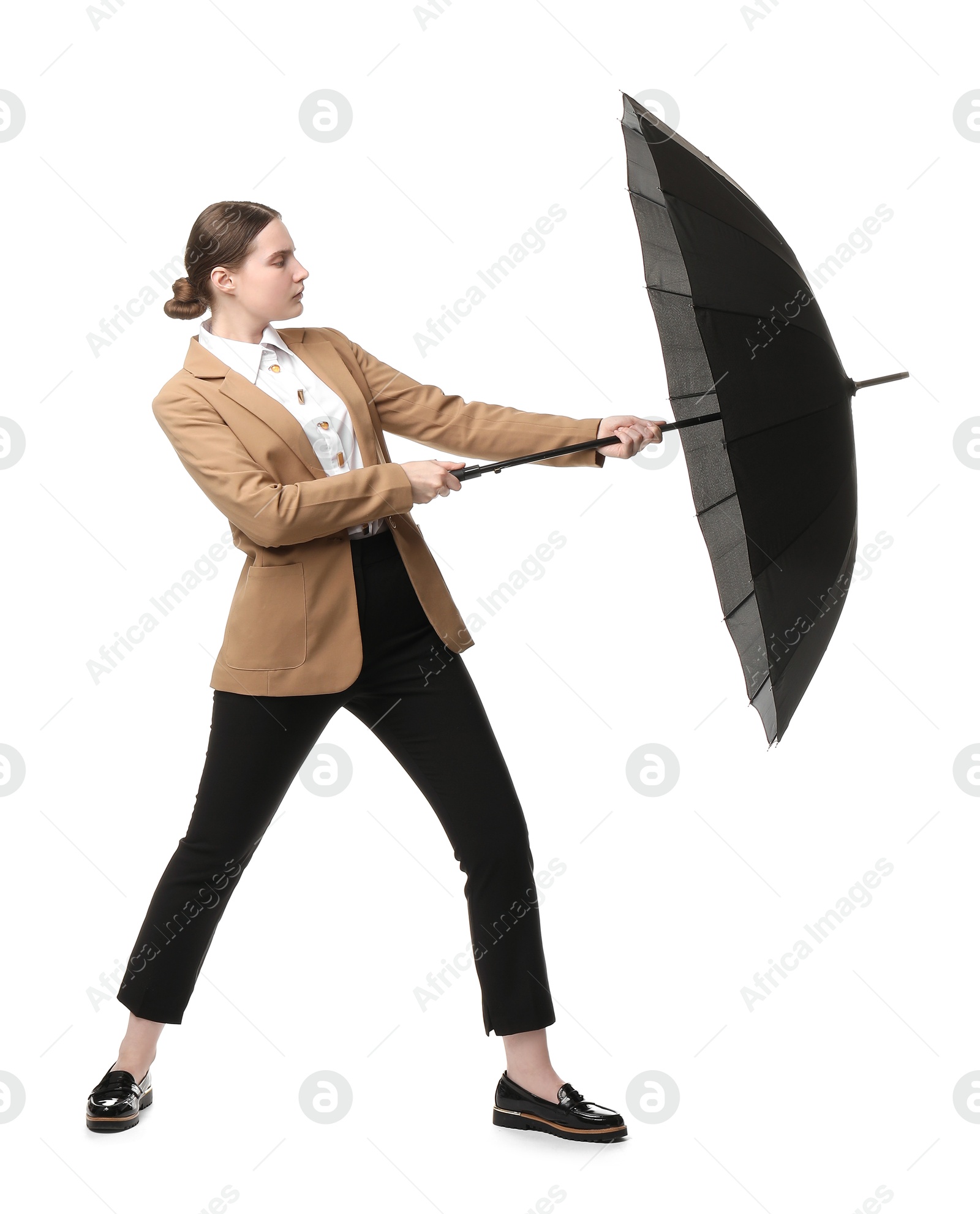 Photo of Young woman with black umbrella on white background