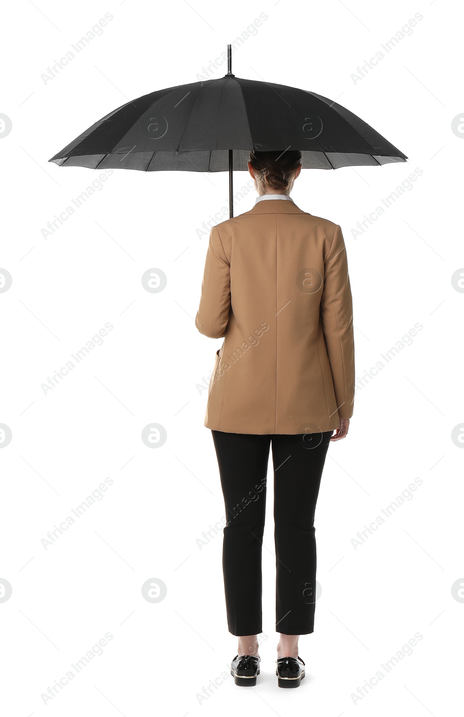 Photo of Young woman with black umbrella on white background, back view