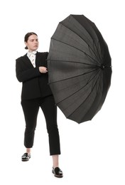 Photo of Young woman with black umbrella on white background