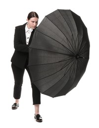 Photo of Young woman with black umbrella on white background