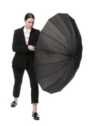 Photo of Young woman with black umbrella on white background