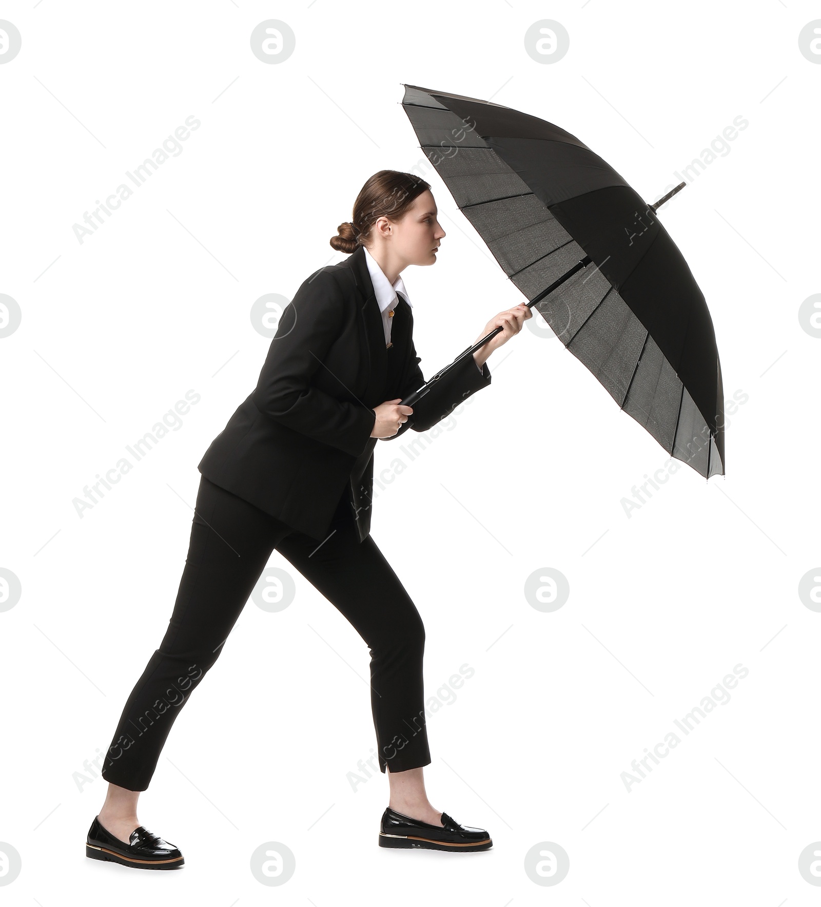 Photo of Young woman with black umbrella on white background