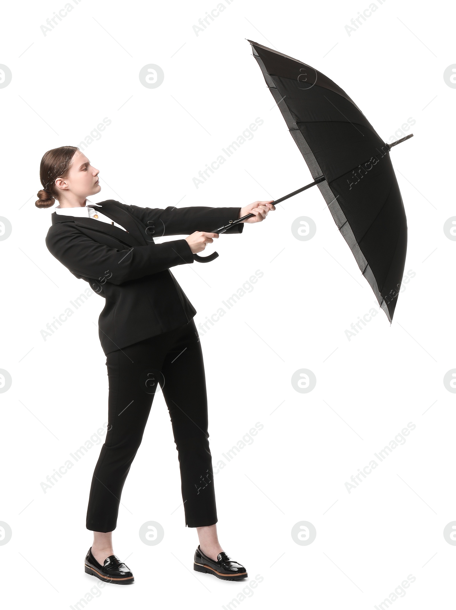 Photo of Young woman with black umbrella on white background