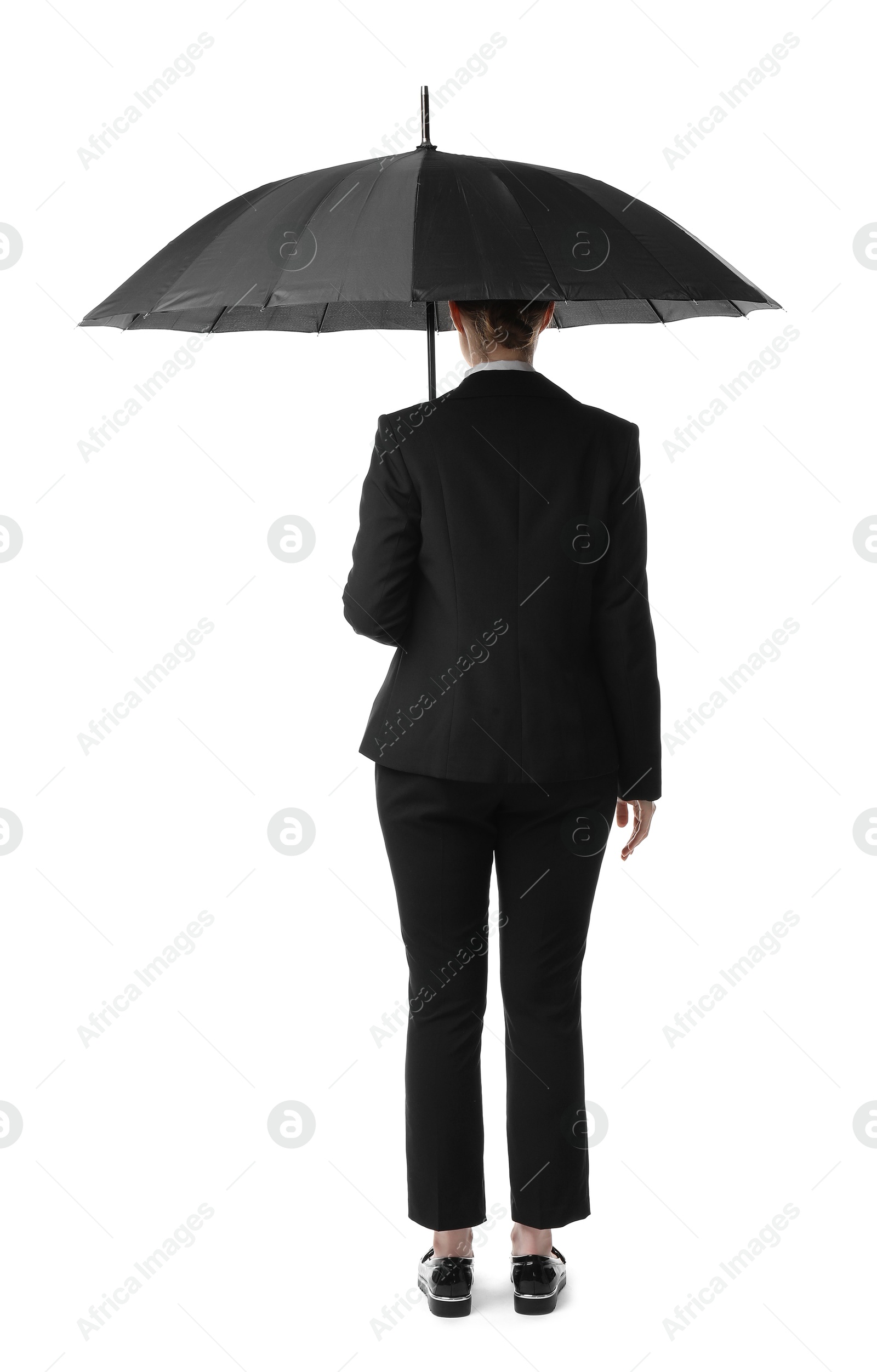 Photo of Young woman with black umbrella on white background, back view