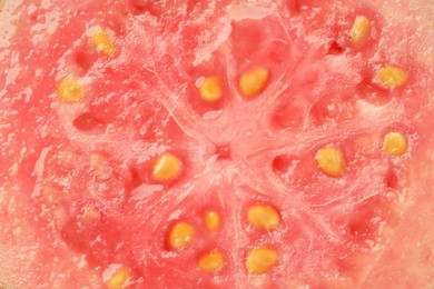 Photo of Juicy guava fruit with seeds as background, top view